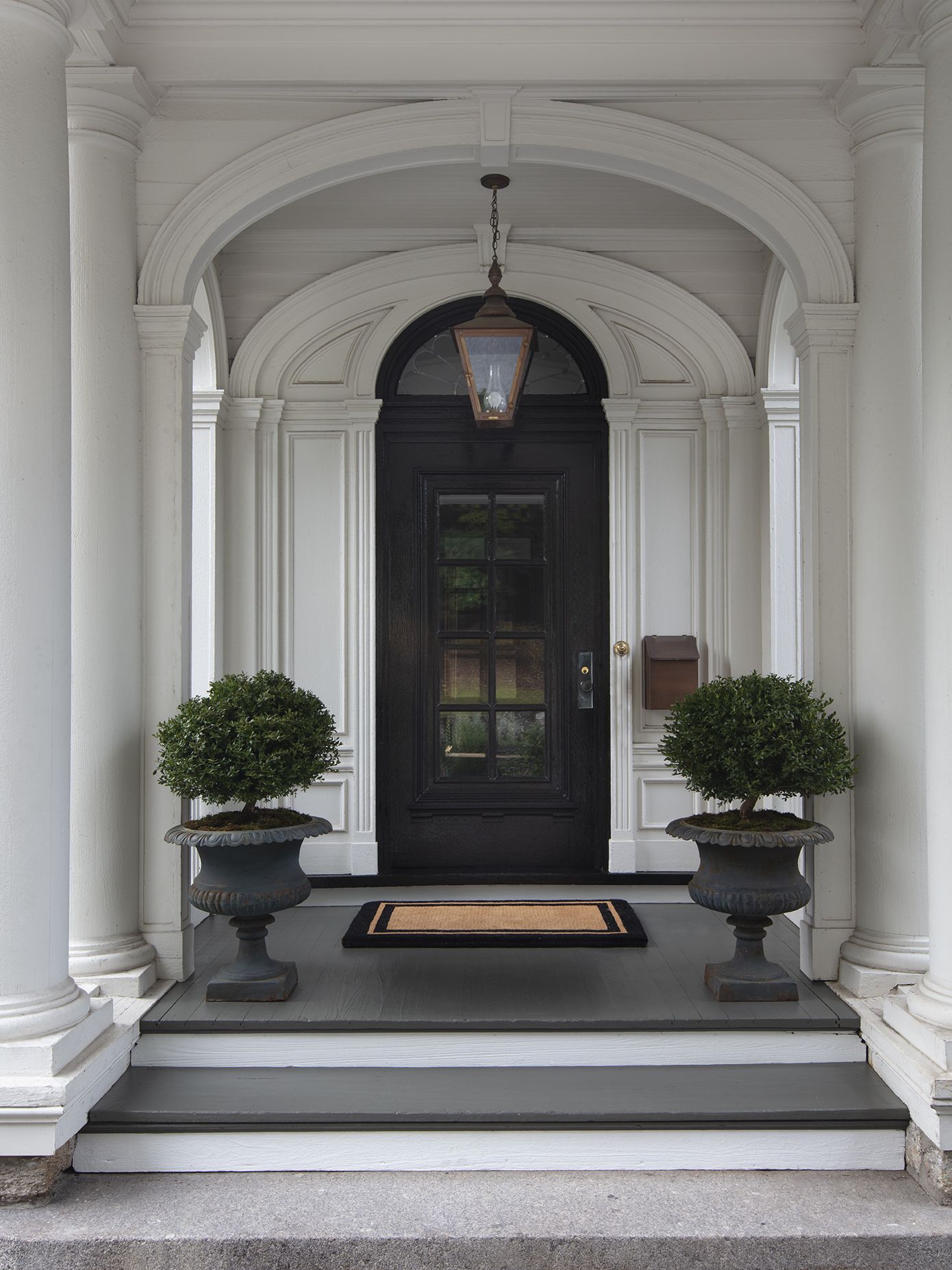 black exterior door on white house