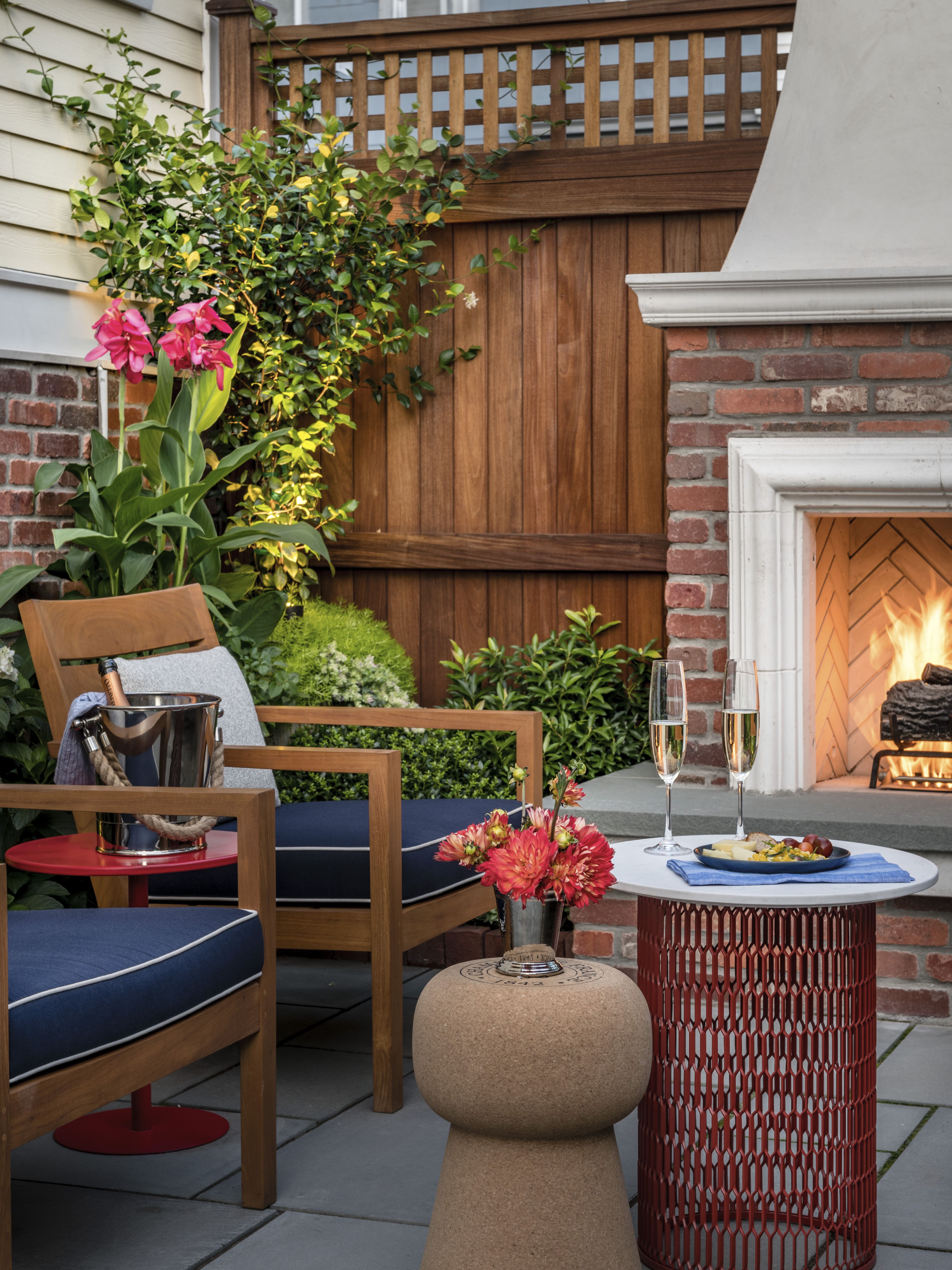 back patio with seating area around fireplace