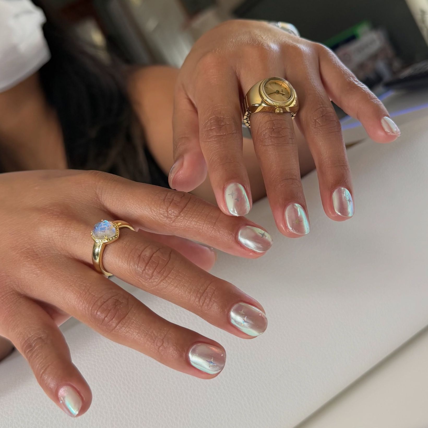 silver chrome polish on short rounded nails