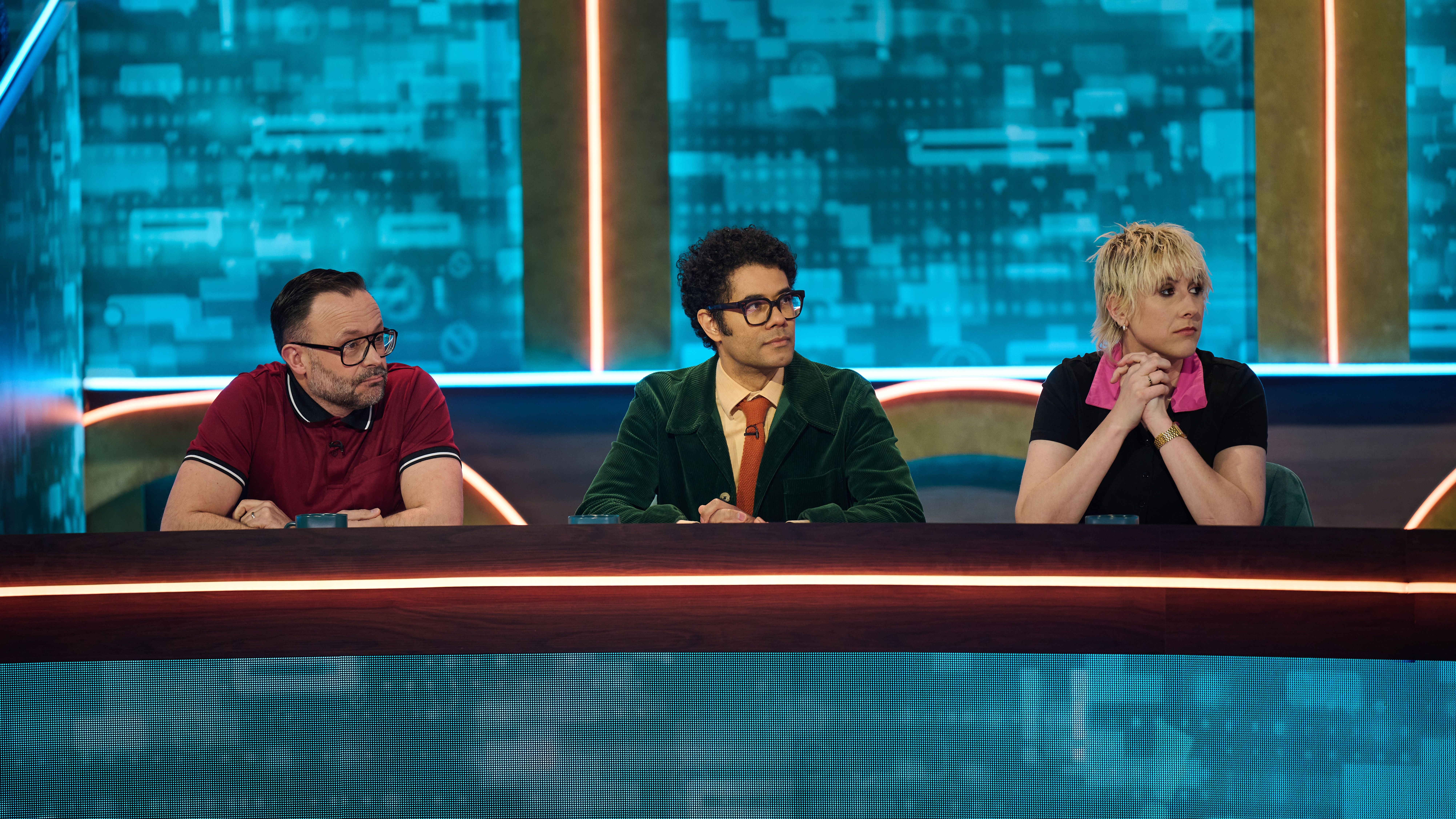 an image from episode two of Unacceptable showing three comedians, from L-R: Geoff Norcott, Richard Ayoade, and Maisie Adams