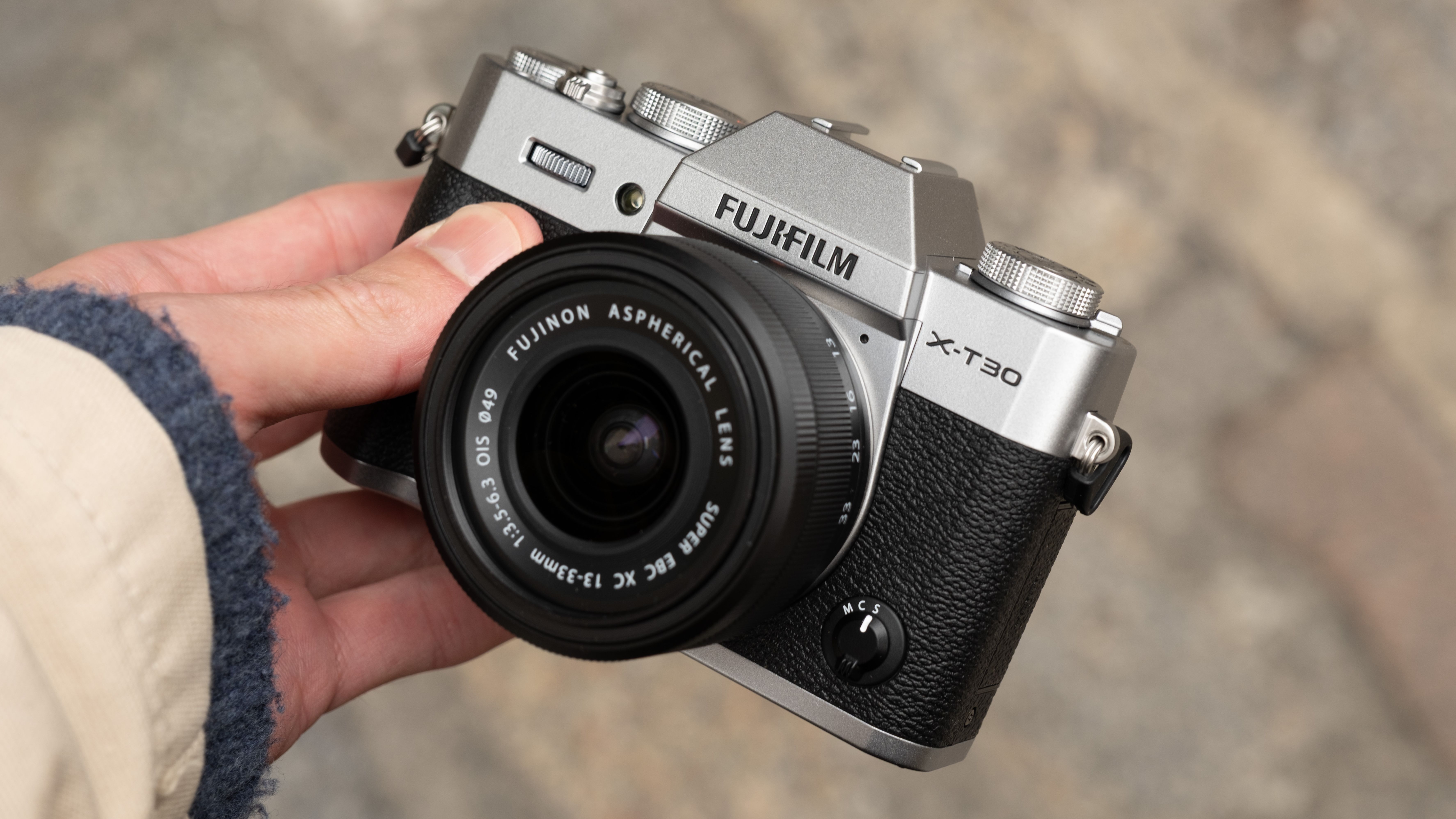 Fujifilm X-T30 III camera held in a hand