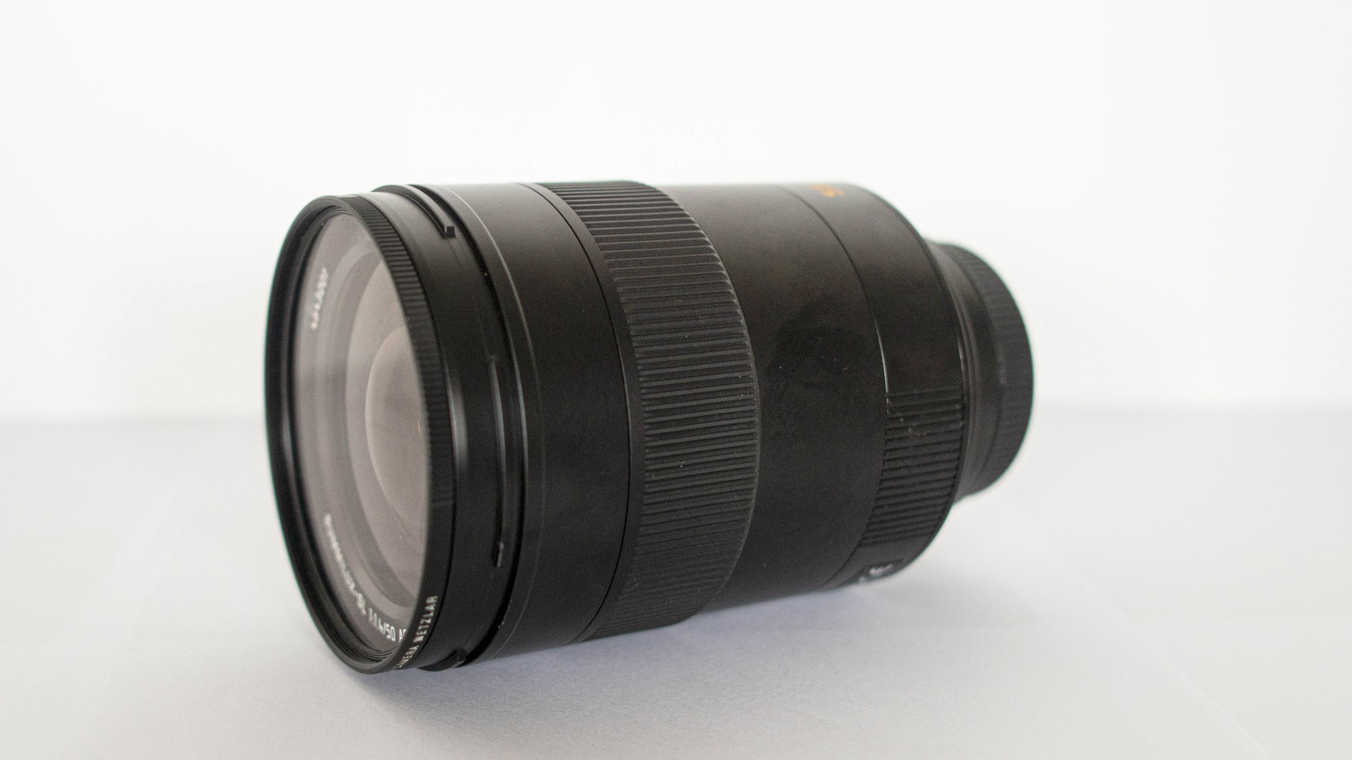 Leica 50mm Summilux-SL f/1.4 ASPH shot against a white background from the underside of the lens