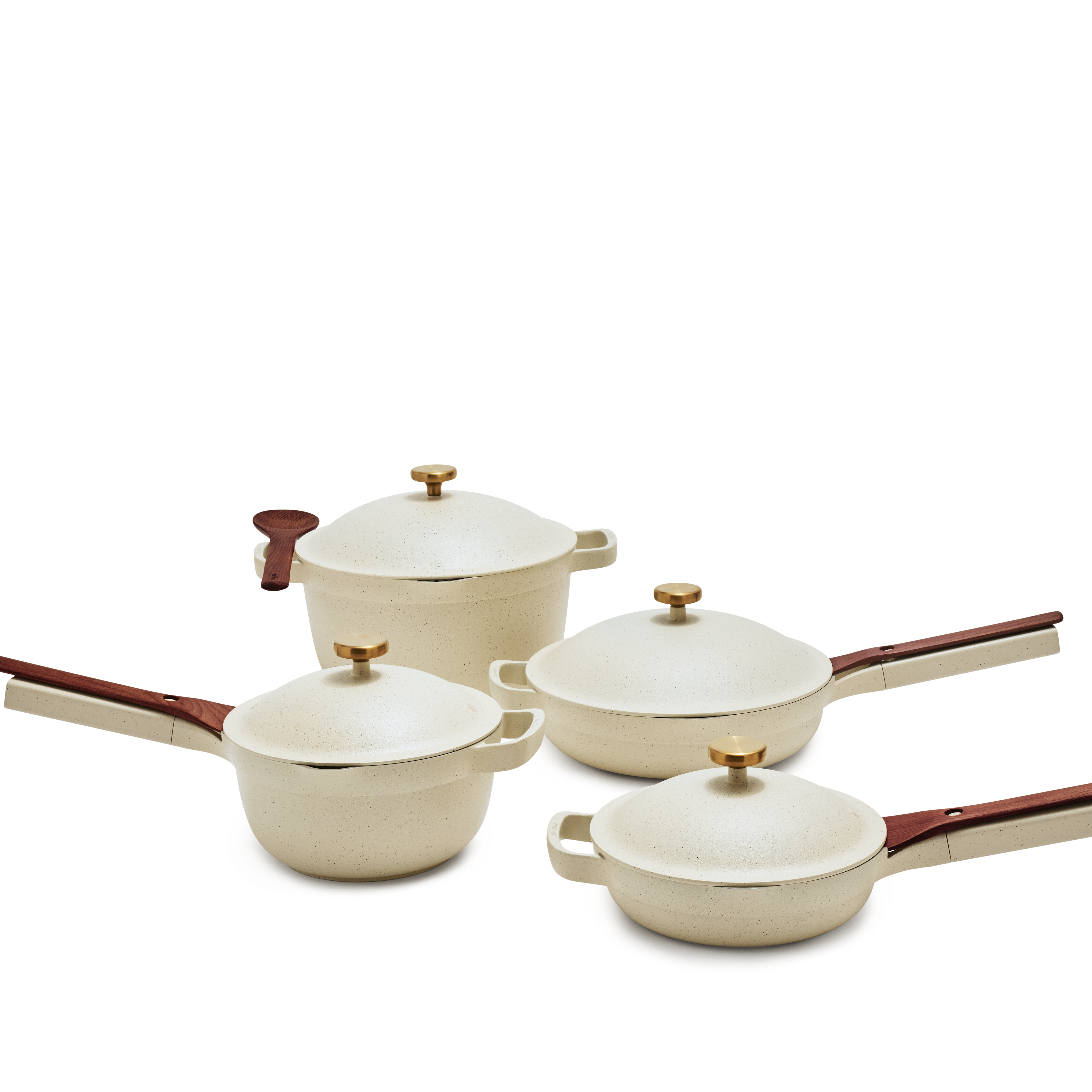 A set of cream pans with wooden spoons and bras lid handles