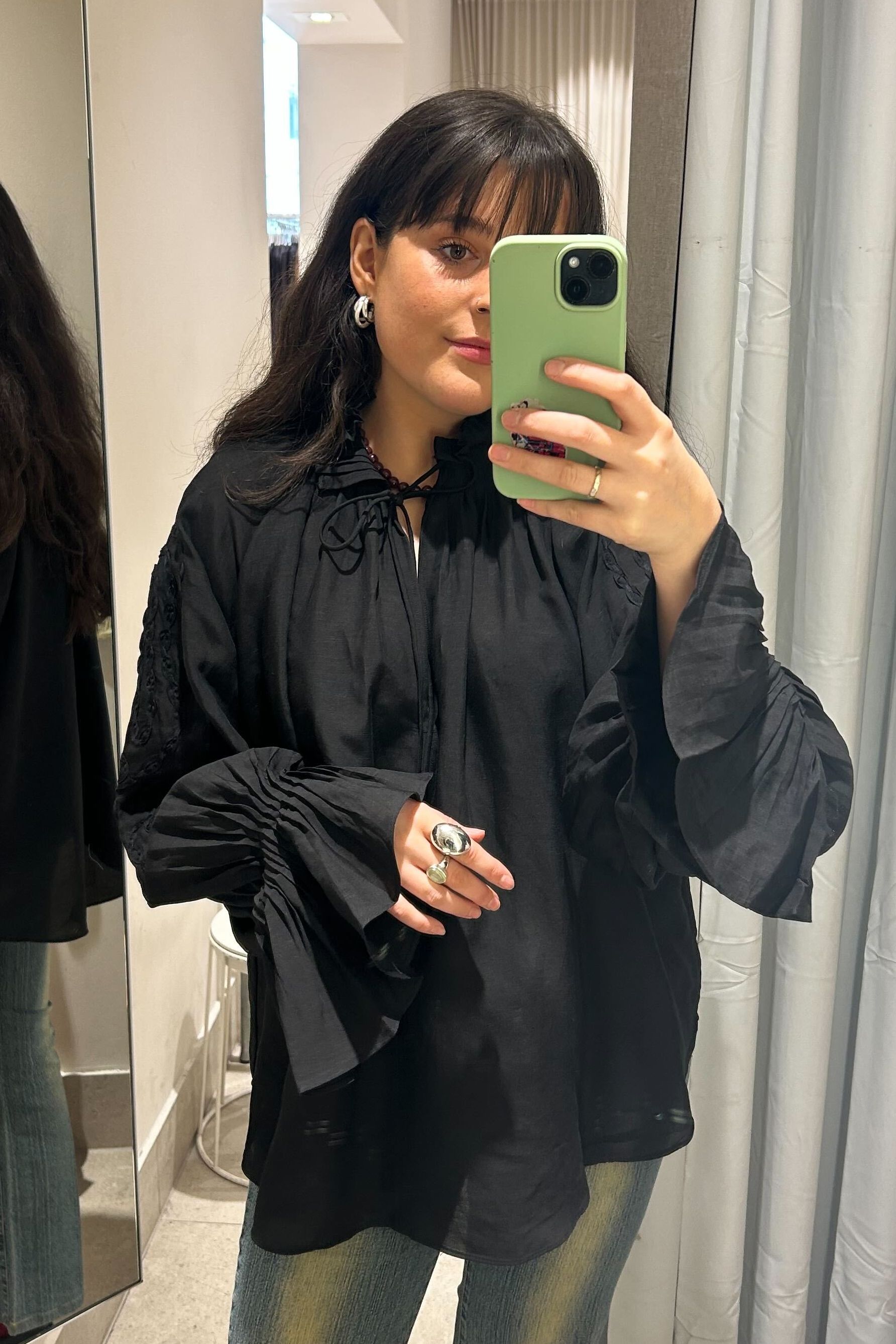 Molly Smith wearing black blouse