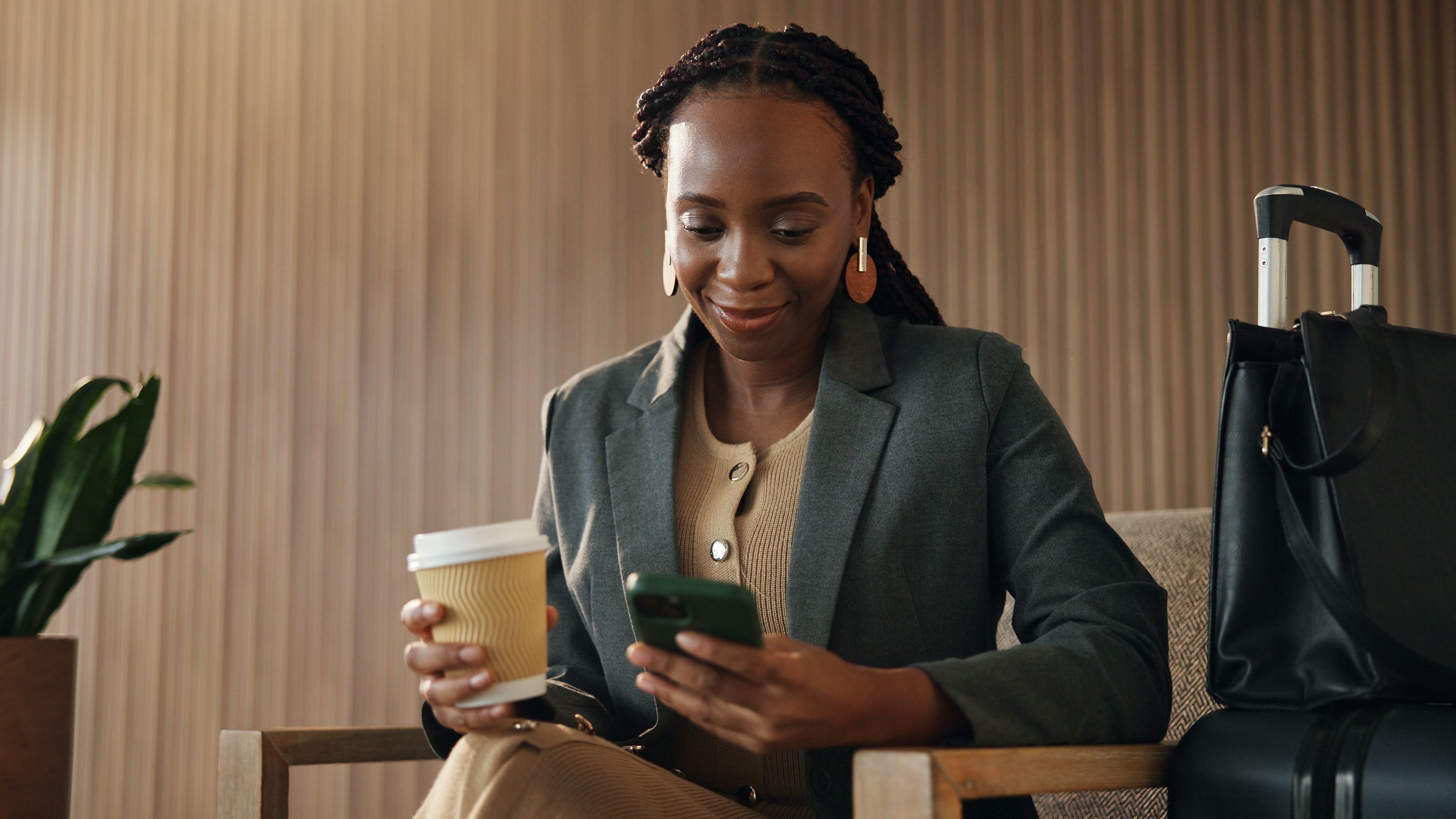 A woman relaxing in an airport lounge before take off.