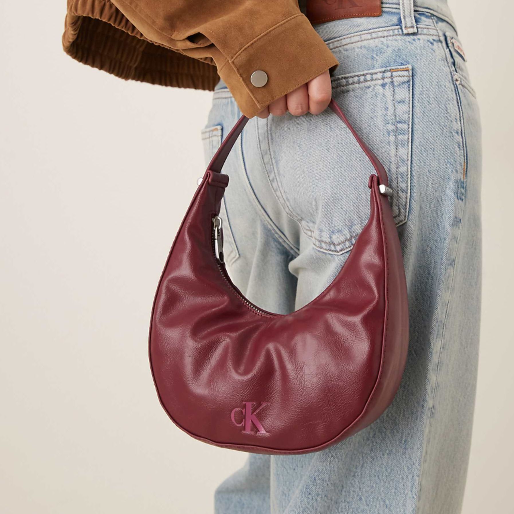 Calvin Klein Jeans Small Glossy Moon Bag in Burgundy