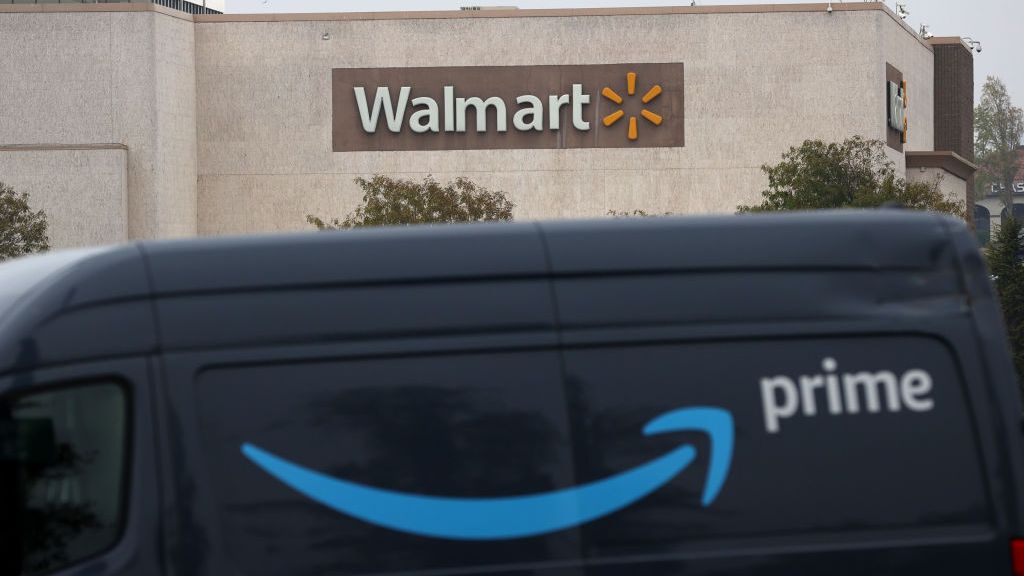 An Amazon Prime van parked in front of a Walmart store