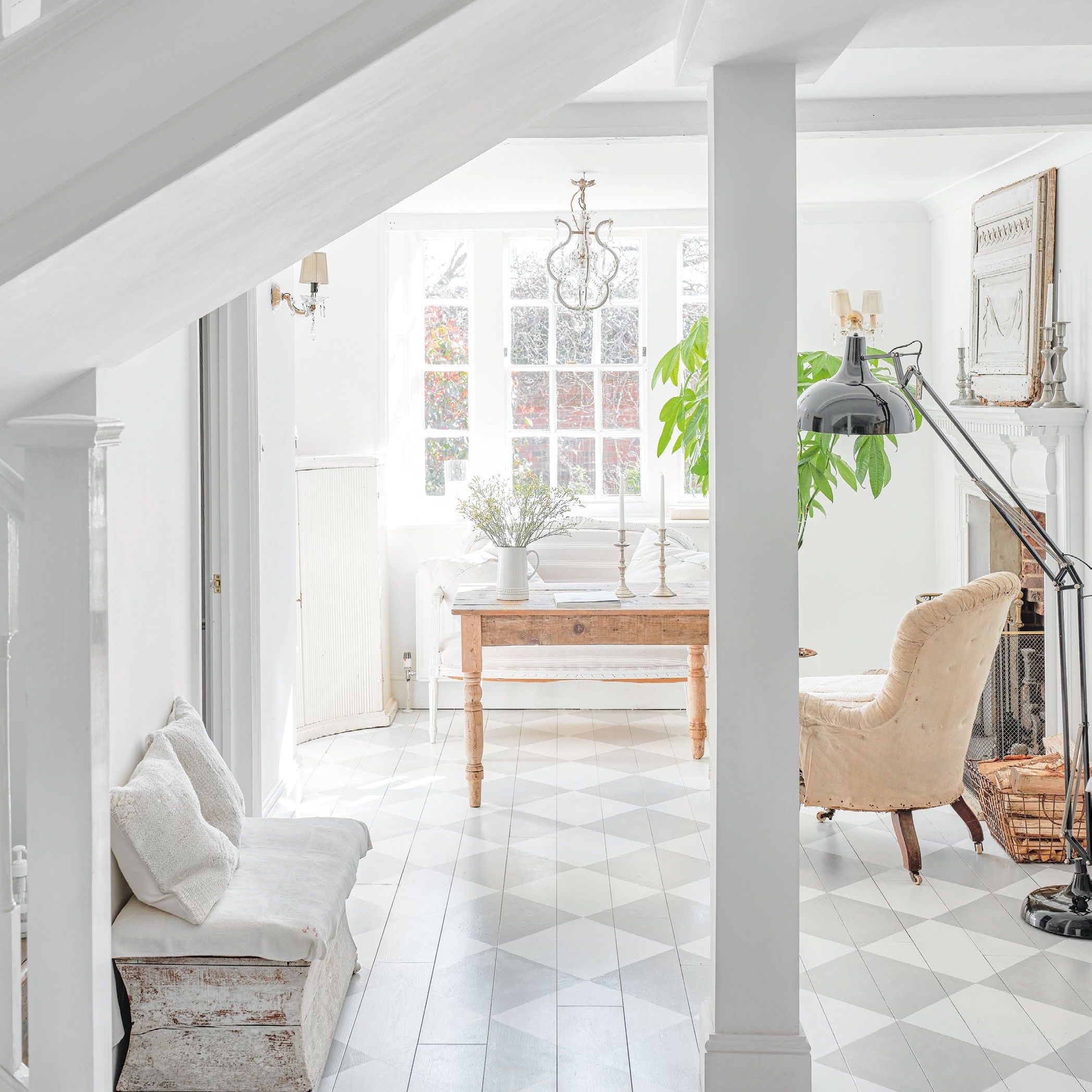 White room with check flooring and light furniture