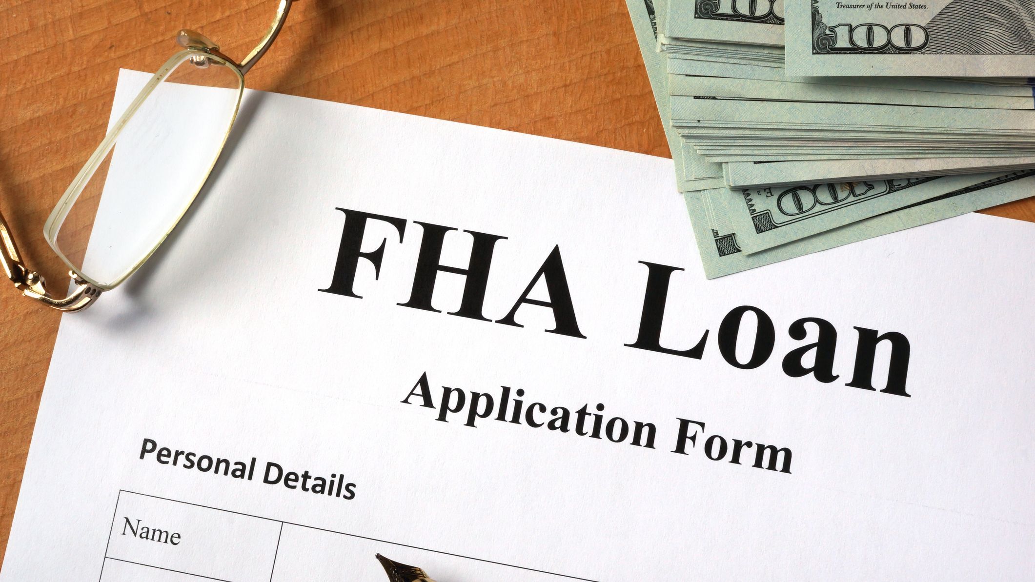 FHA loan form on a wooden table.