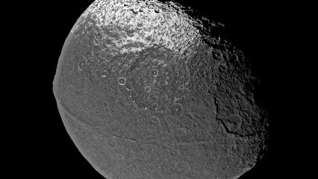 Mystery of Saturn's Walnut Moon Cracked? | Space