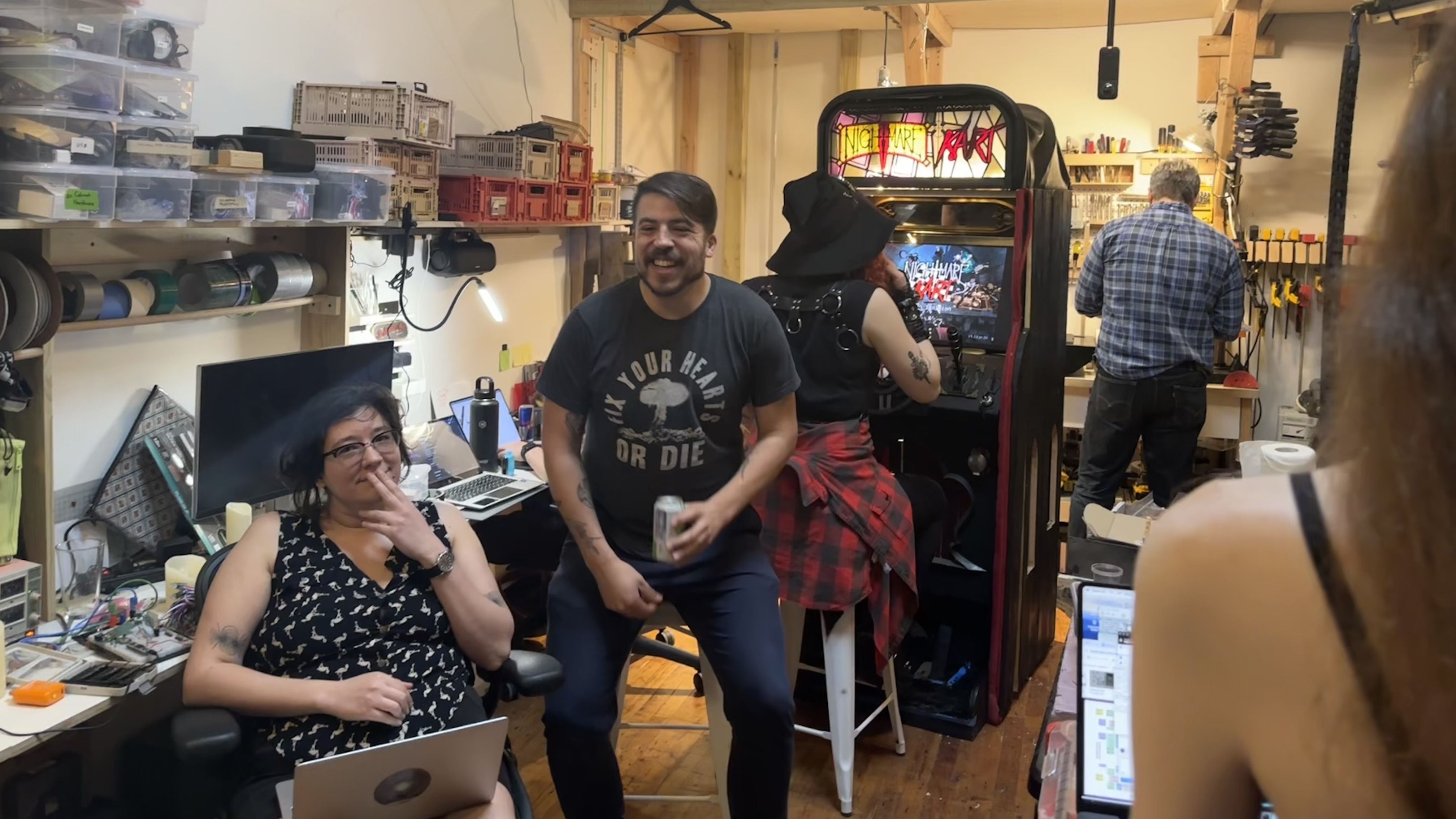 A photo shows Arcade Commons volunteers working on the Nightmare Kart cabinet