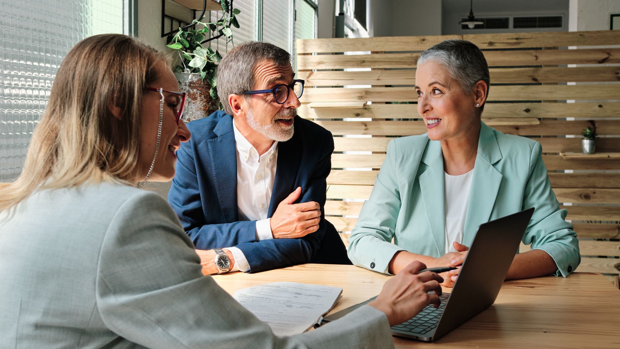 A couple discussing their insurance policy with their agent