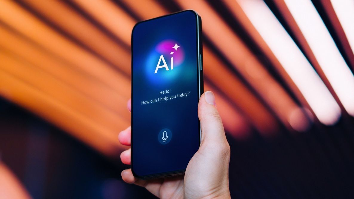 A hand holding a phone with AI on the screen