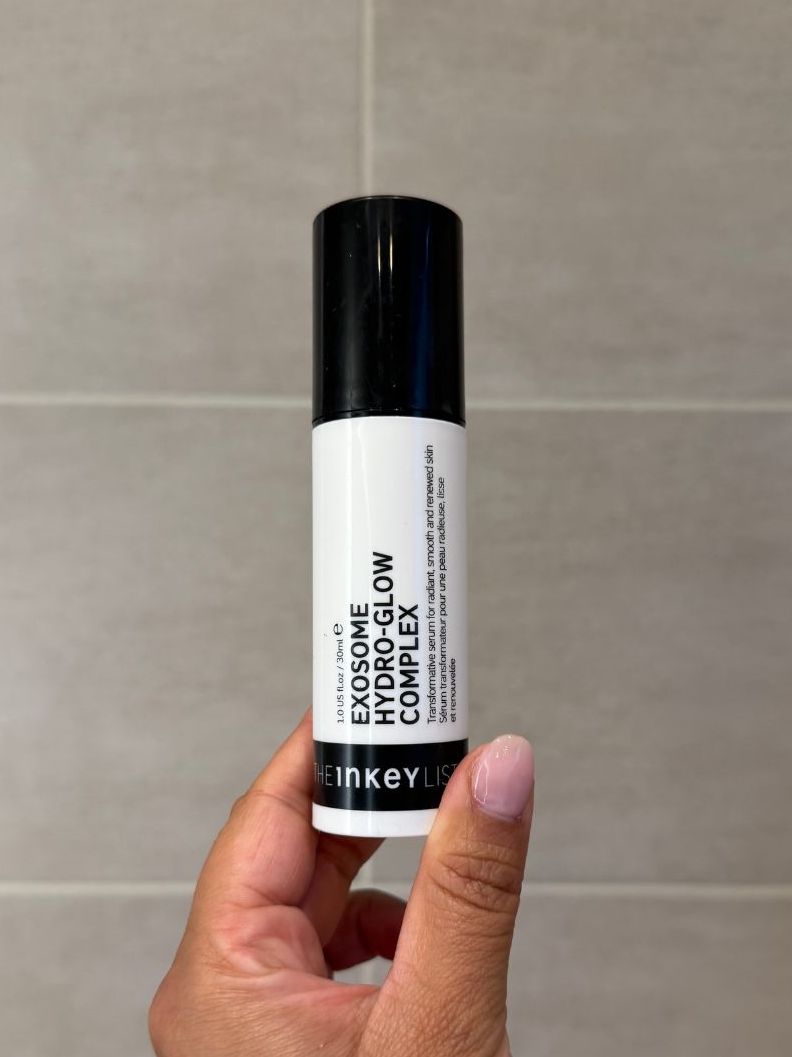 Aleesha holding empty The Inkey List Exosome Hydro-Glow Complex