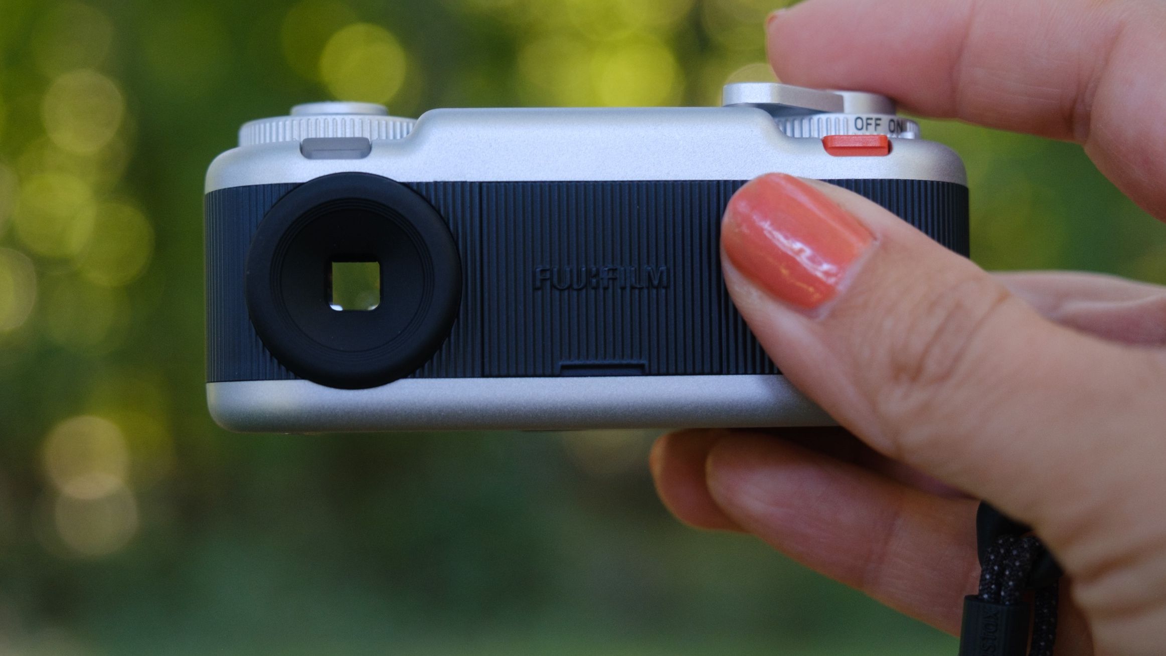 The Instax Pal 2 held in a photographer's hands