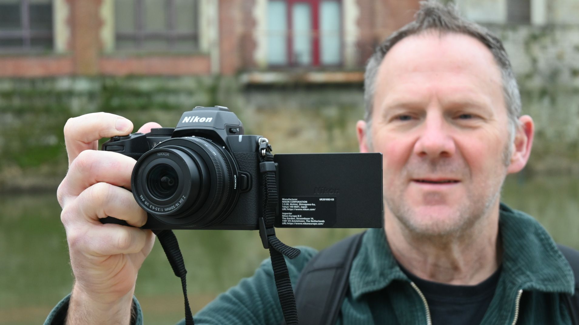 Man holding Nikon Z50 II