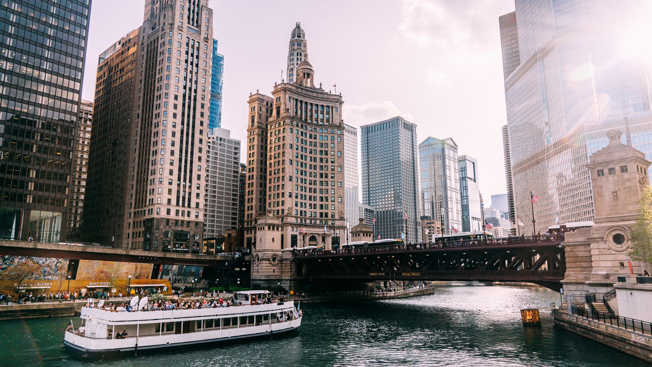 Afternoon View of a Tourist Boat Passing under the DuSable Michigan Avenue Bridge on the Chicago River in Springtime