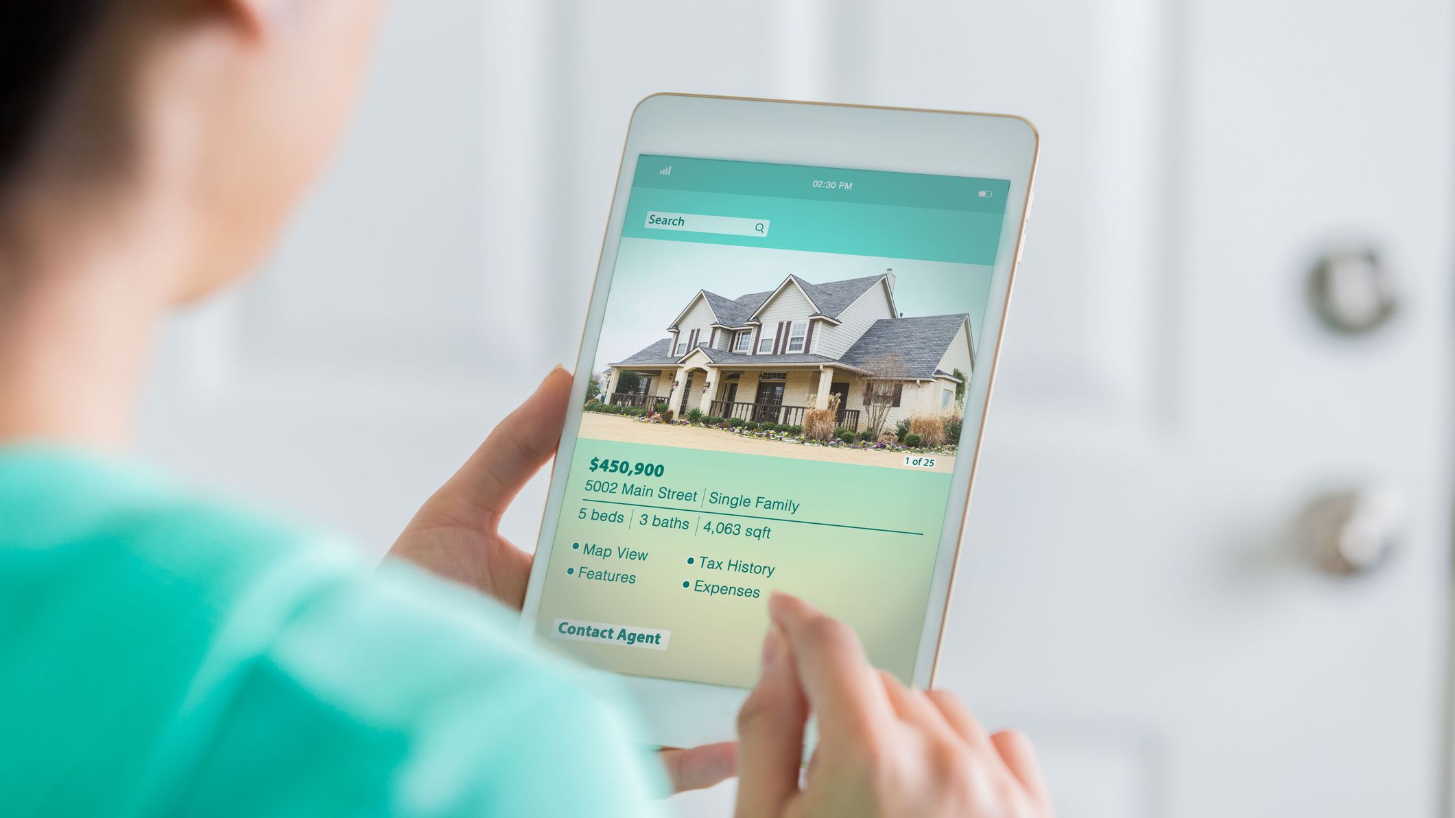 Woman uses digital table to search for new home