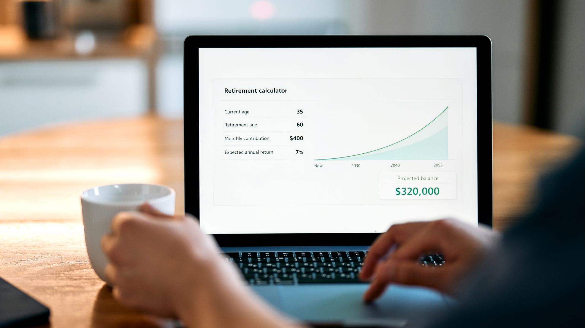 Man reviewing a retirement savings calculator on a laptop at home