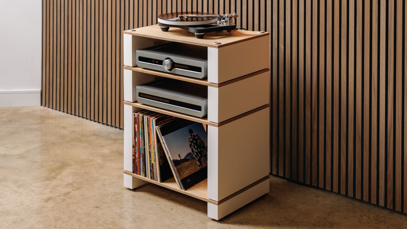 Blok Stax 2G hi-fi rack against wooden wall with turntable, amps and records
