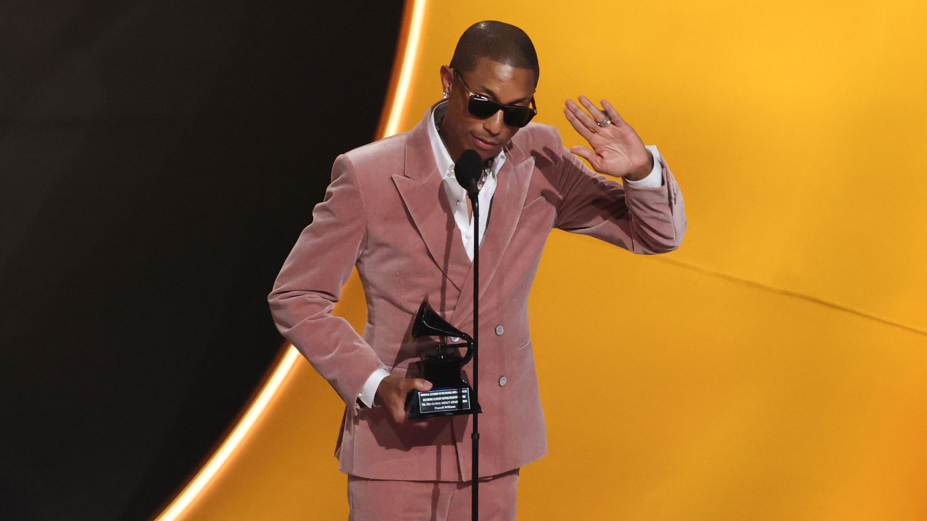 US singer-songwriter and producer Pharrell Williams speaks after being presented with the Dr. Dre Global Impact Award on stage during the 68th Annual Grammy Awards at the Crypto.com Arena in Los Angeles on February 1, 2026. (Photo by VALERIE MACON / AFP) / -- IMAGE RESTRICTED TO EDITORIAL USE - STRICTLY NO COMMERCIAL USE --