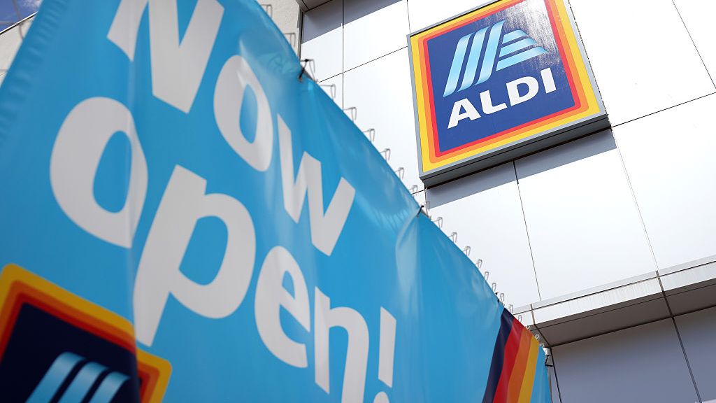 A banner hanging from the entrance of a new Aldi store