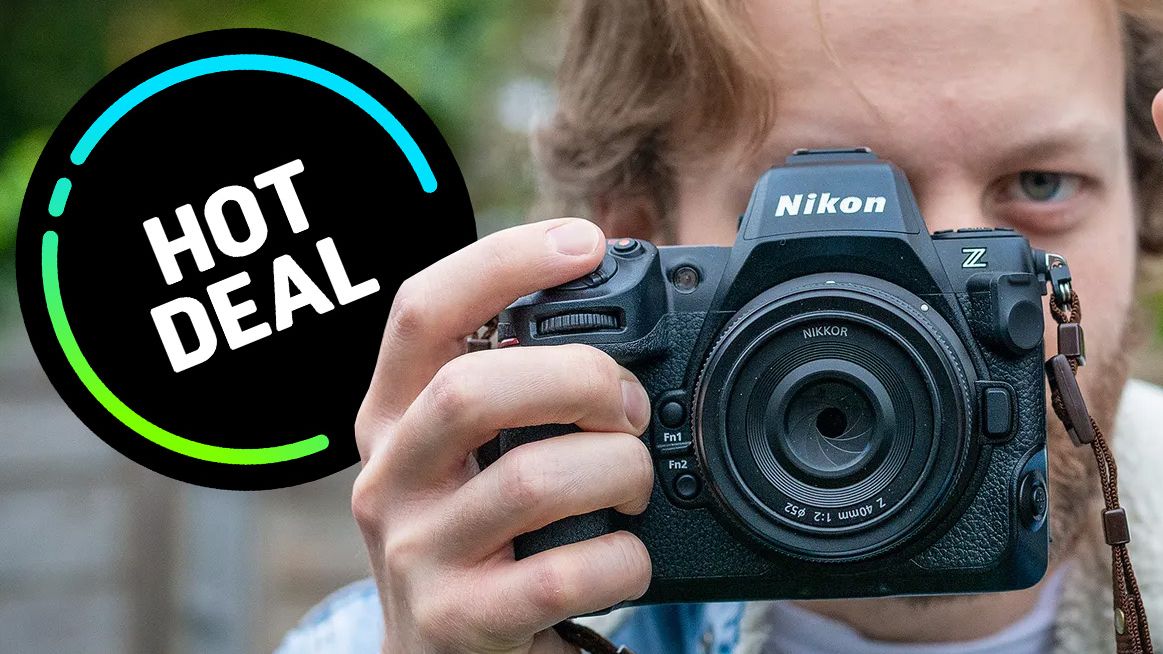 Man holding Nikon Z8 and Sekonic Studio Deluxe III light meter, with 'Hot Deal' roundel on the left