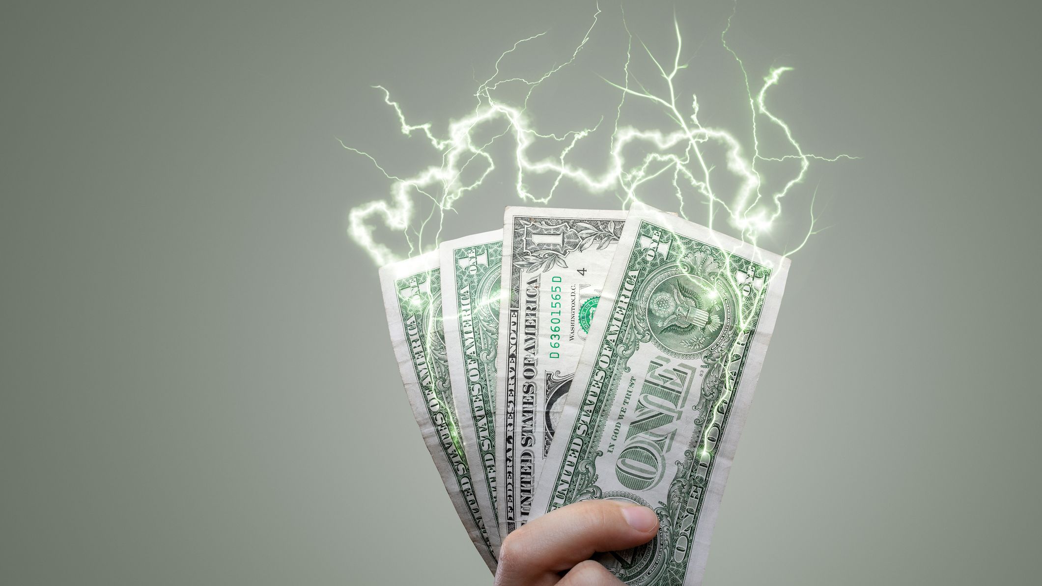 dollar bills emitting electricity signaling higher energy bills