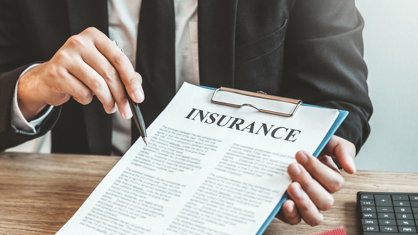 Insurance agent and customer discuss insurance contract.