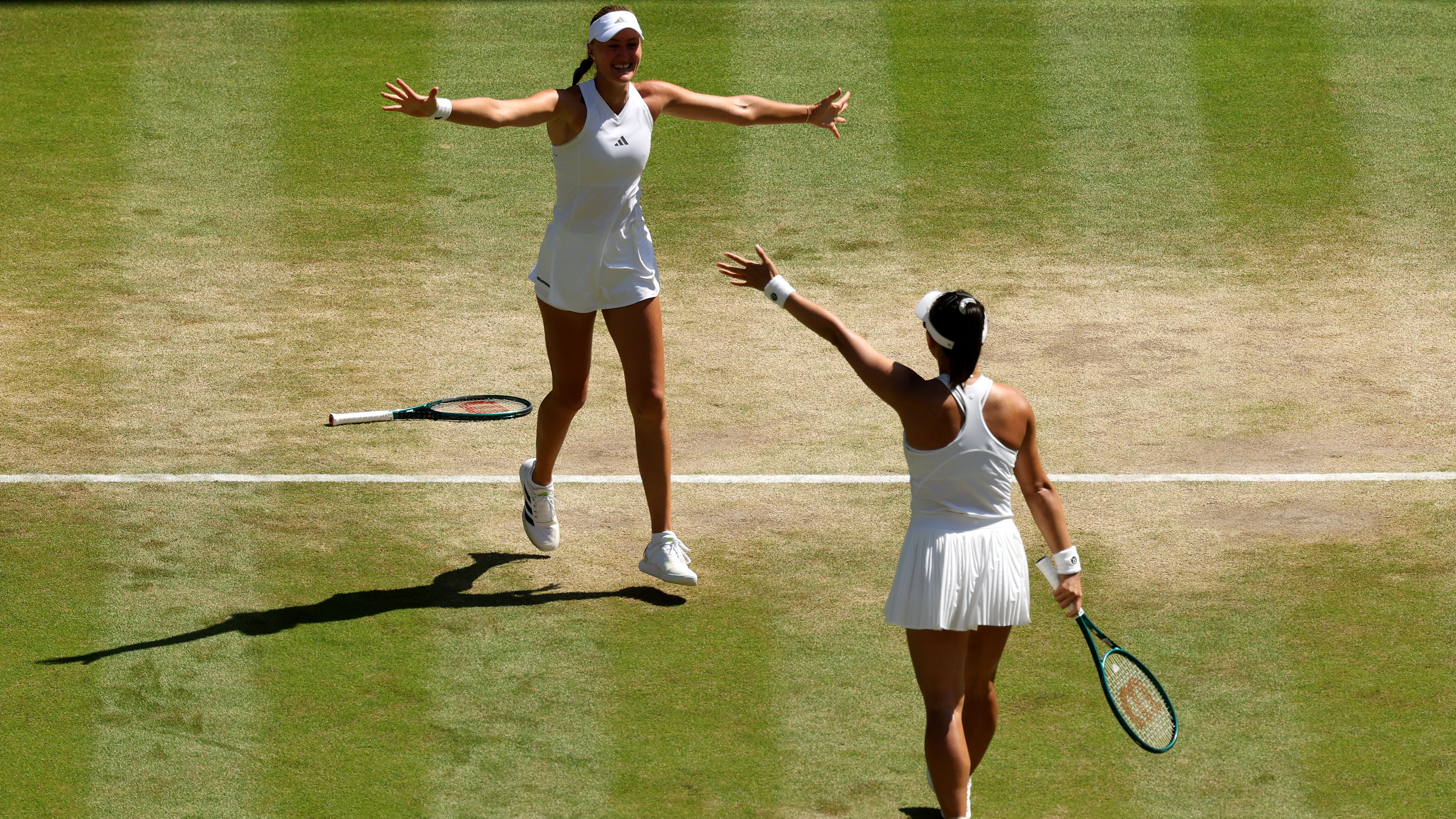 Kristina Mladenovic and Hanyu Guo approach for an embrace after winning the Wimbledon 2026 women's doubles final