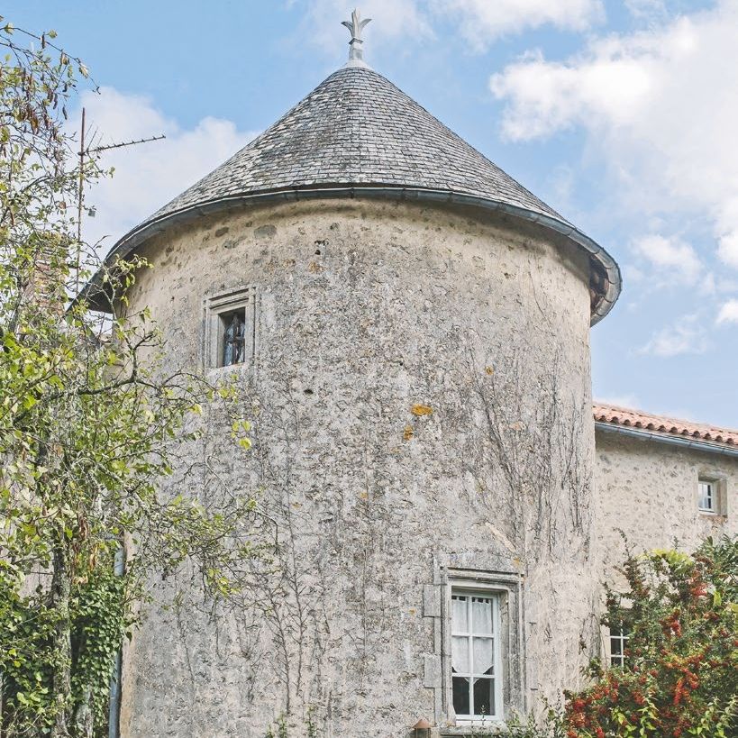 exterior of a medieval french tower converted into a home