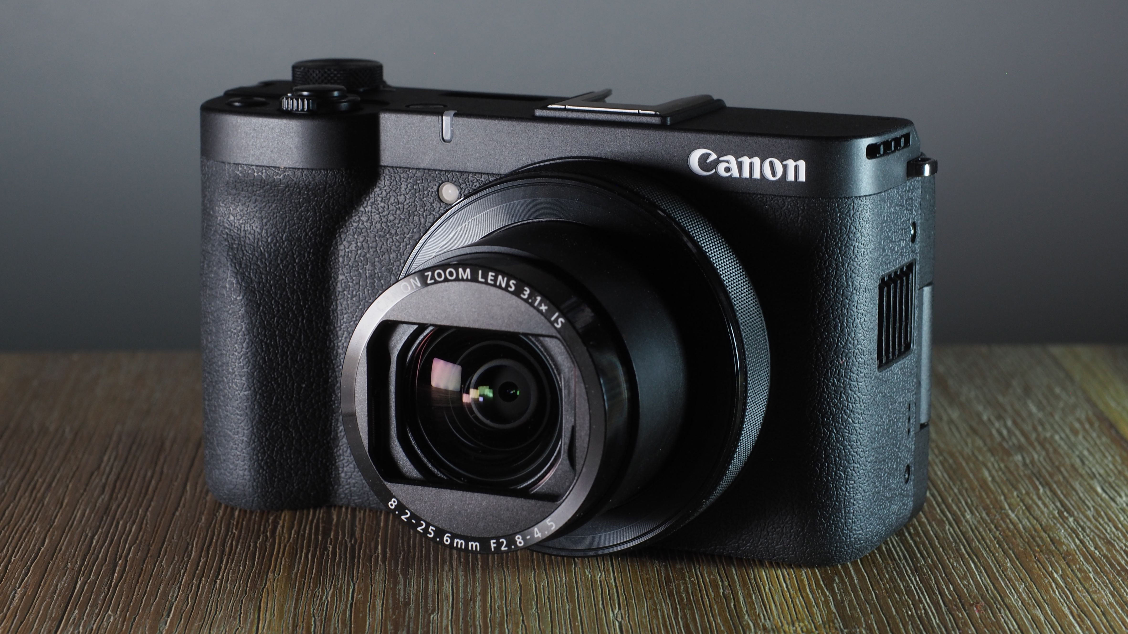 Canon PowerShot V1 on a wooden surface