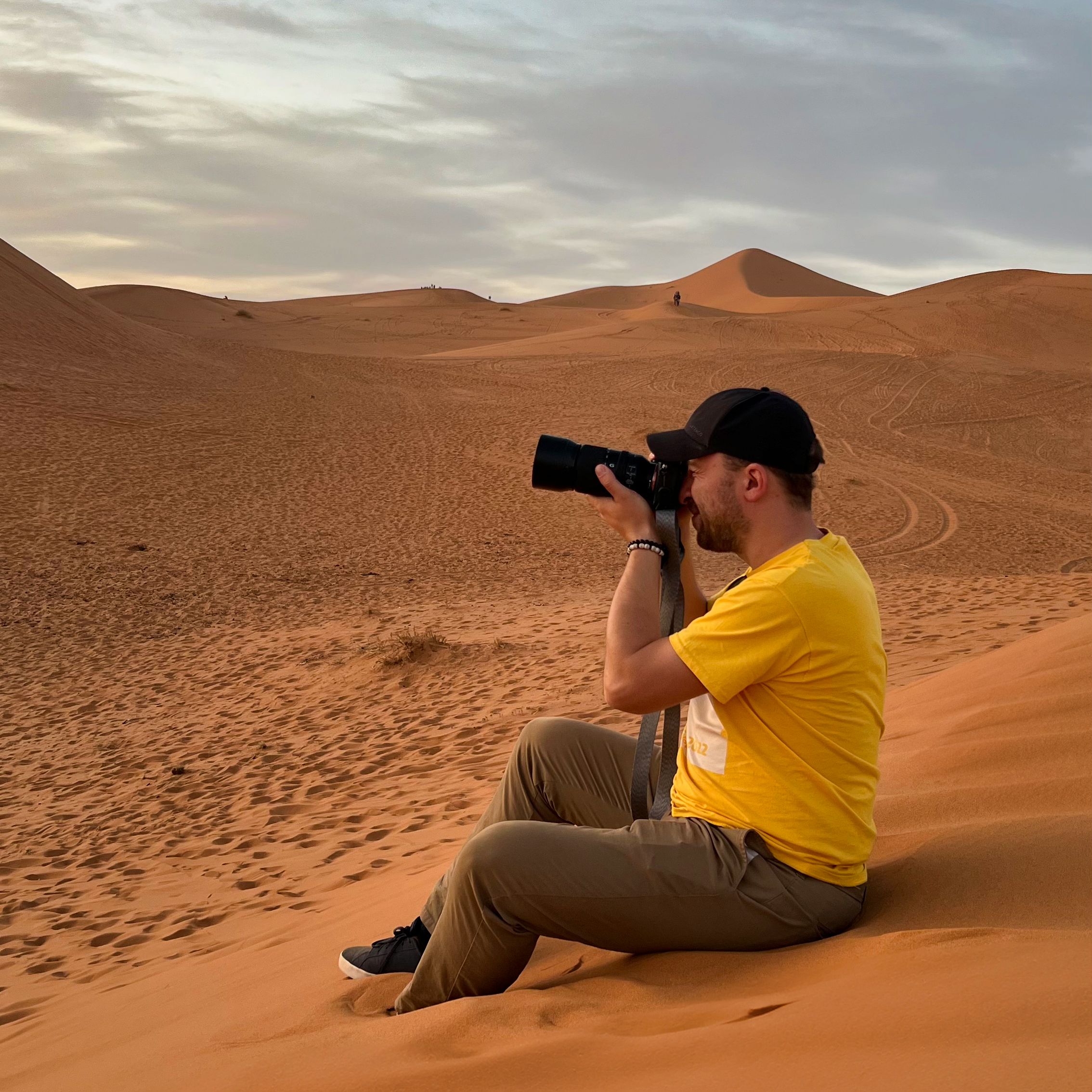 Jakub Bors on location, getting a shot of the camel against the setting sun