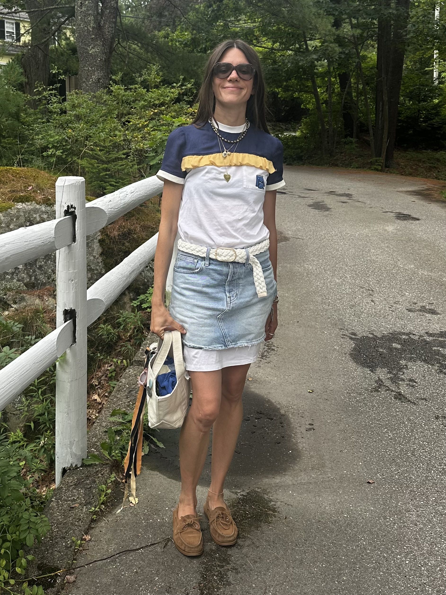 Julia Gall wears a denim skirt over a T-shirt dress