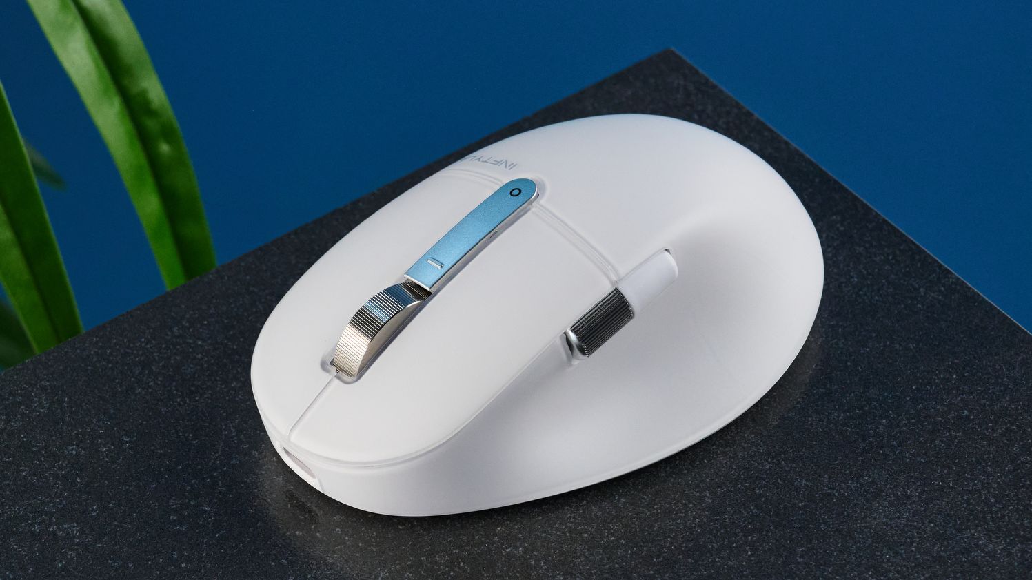 A white BenQ INFTYLAB M Mouse PS01 mouse