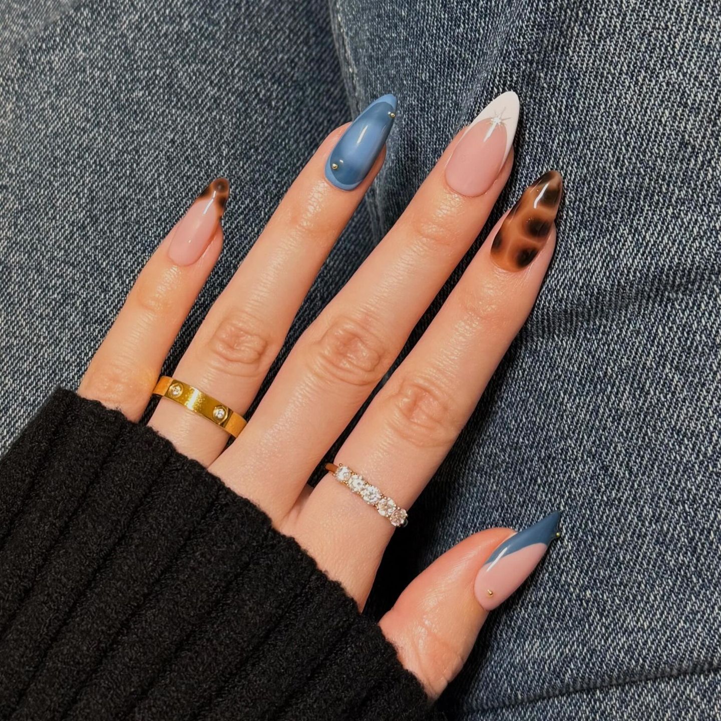 blue manicure with alternating nails in leopard print