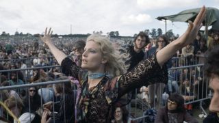 BATH, ENGLAND - JUNE 27: A female fan in the crowd attending the Bath Festival of Blues and Progressive Music at the Royal Bath and West Showground in Shepton Mallet, England on 27 June, 1970. 