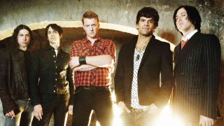 Queens Of The Stone Age posing for a photo in 2007