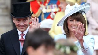 Michael and Carole Middleton smile and wave at the crowds following the marriage of Prince William, Prince of Wales and Catherine, Princess of Wales at Westminster Abbey in 2011