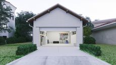 Open door of a modern garage with a concrete driveway at the urban district.