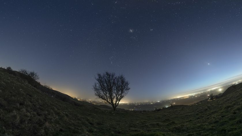 photo of the night sky showing seven planets aligned across the sky in a planetary parade. 