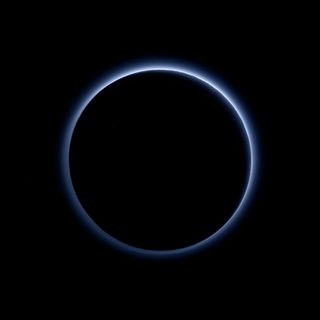 Pluto’s haze layer displays a blue color in this image obtained by the New Horizons spacecraft's Ralph/Multispectral Visible Imaging Camera. Image released Oct. 8, 2015.
