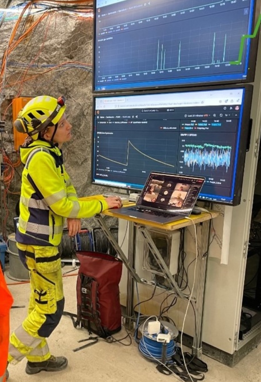 A researcher monitors seismological data on multiple screens