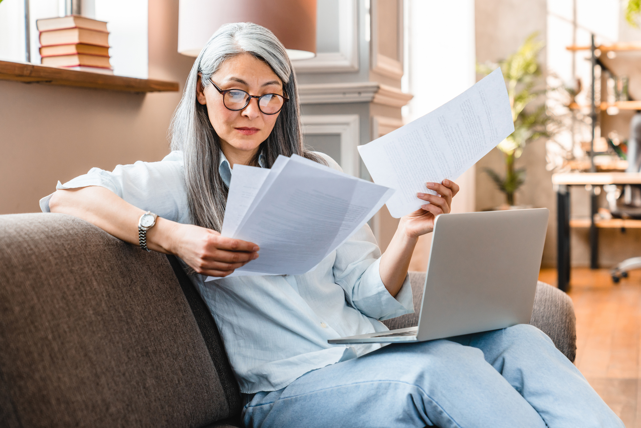 A woman reading the fine print of a contract.