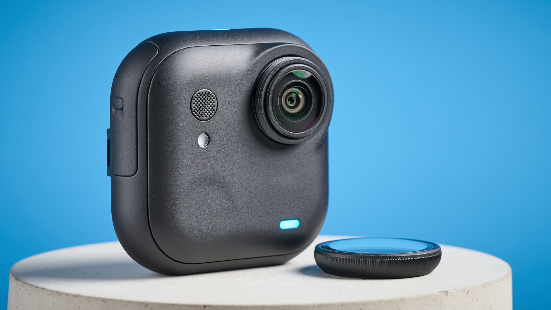 Insta360 Go Ultra core camera against a blue background