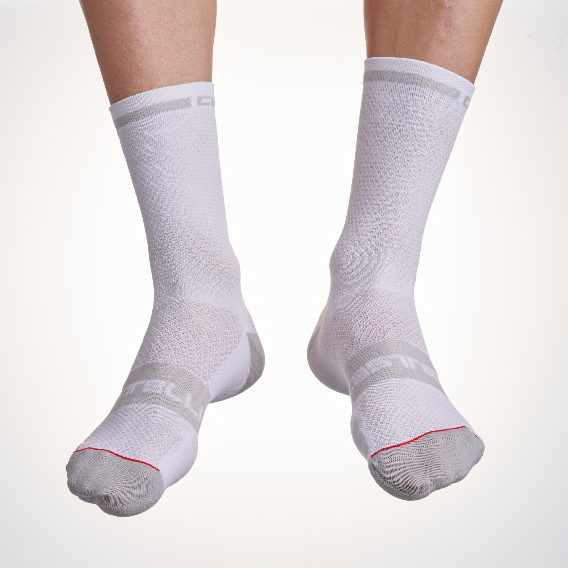 Male cyclist wearing the Castelli Superleggera T12 cycling socks