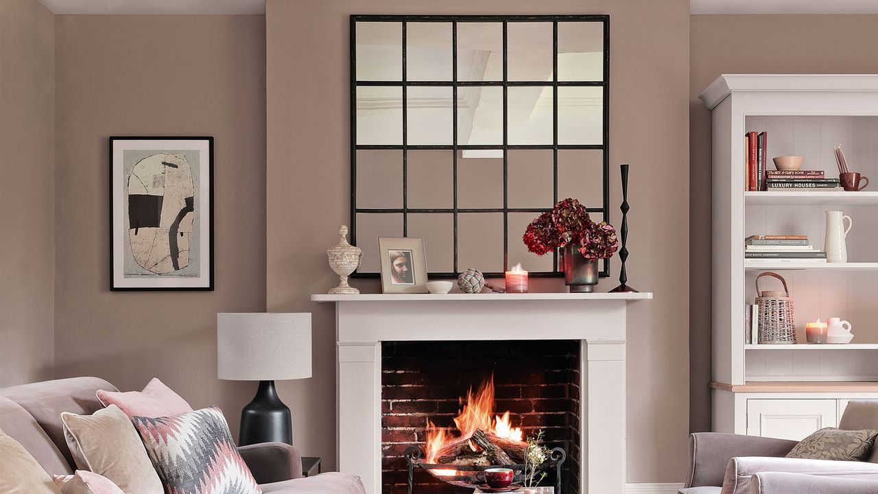 Neutral living room with window-style mirror above the fireplace