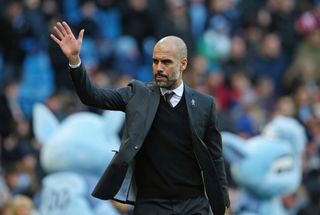 Manchester City manager Pep Guardiola waves ahead of a game against Burnley in January 2017.