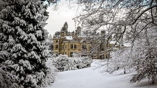 Exterior of Palé Hall hotel in the snow