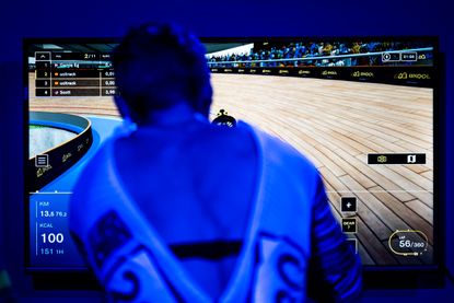 A rider warming up on a virtual bike racing machine at UCI Track Champions League in Mallorca